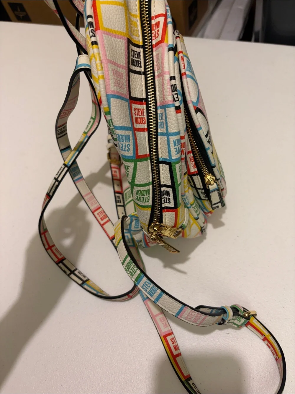 Steve Madden White Mini Backpack with Multicolor Logo Grid